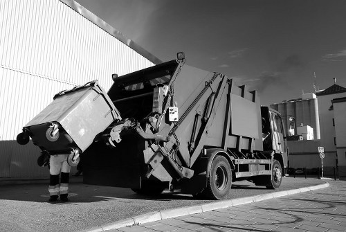 Happy customers with their hired skip from Sudbury Skip Hire