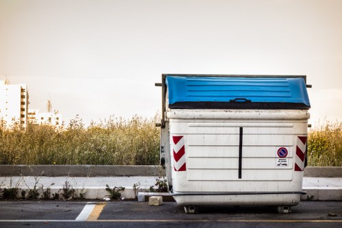 Team members handling skip waste responsibly