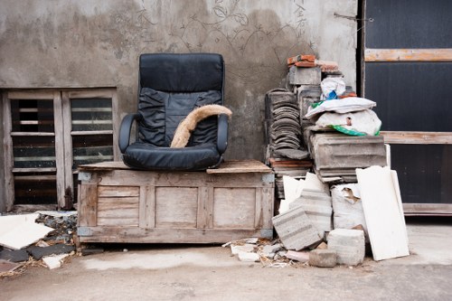 Workers segregating different types of demolition debris