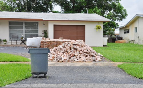 Team handling waste with a commercial skip